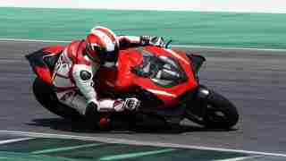 Claudio Domenicali riding the Ducati Superleggera V4